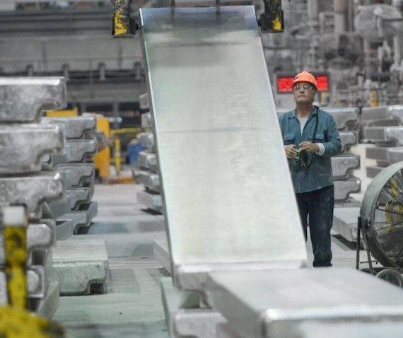 Casting specialist Ron Moa lifts an aluminum t-ingot at the Alcoa Intalco Works aluminum smelter west of Ferndale on Friday, Aug. 12, 2016. The smelter is celebrating its 50th anniversary as it plans for the challenges ahead.