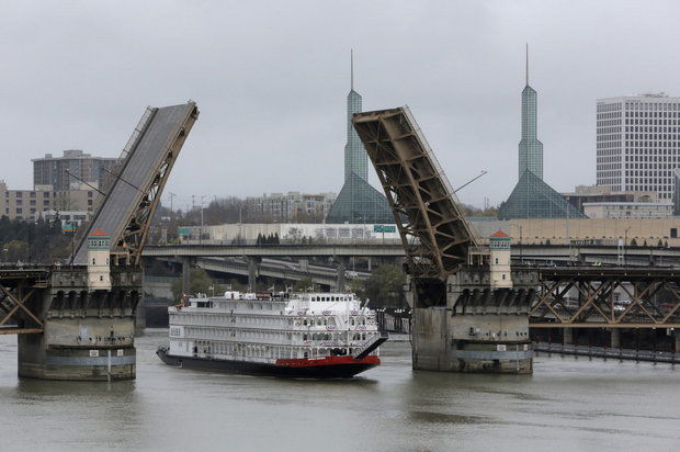 The American Empress cruises beneath the Burnside Bridge as it enters downtown Portland on the Willamette River. (Michael Lloyd/The Oregonian)