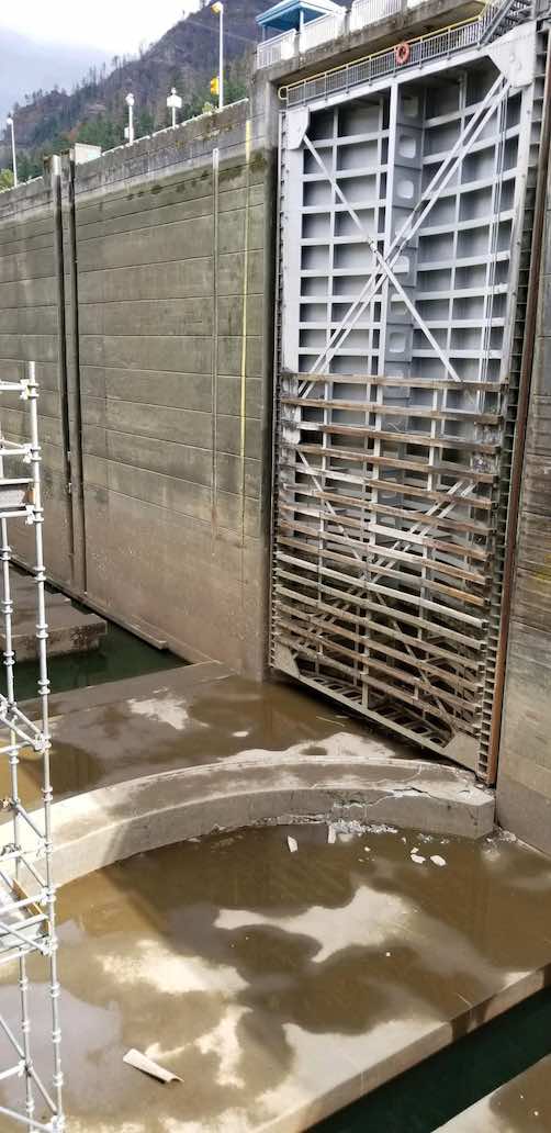 This September 8, 2019 photo provided by the U.S. Army Corps of Engineers shows a crack in a concrete sill on a boat lock on the Bonneville Dam on the Columbia River than connects Oregon and Washington at Cascade Locks, Oregon.