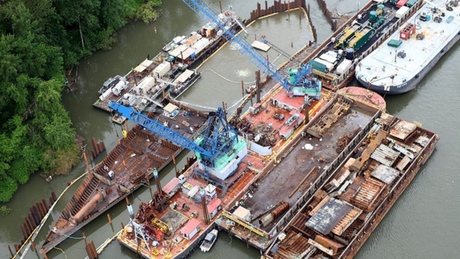 In 2011, government contractors built a cofferdam around the Davy Crockett so it could be deconstructed in the water. Workers removed 38,397 gallons of bunker oil. | credit: Washington State Department of Ecology.