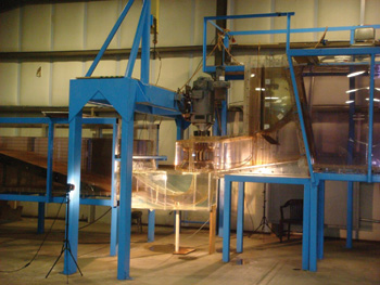 The Ice Harbor model shown above is COE's observational test stand in Vicksburg. The transparent intake, spiral case, discharge ring, draft tube and tailrace walls make necessary observations possible.