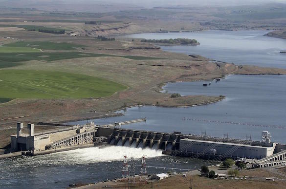 An aerial view of the Ice Harbor Dam near Pasco, looking east up the Snake River, on April 5, 2019. The reservoir behind the dam retains so much heat that the temperature exceeds the state standard for salmon survival in August every single day.