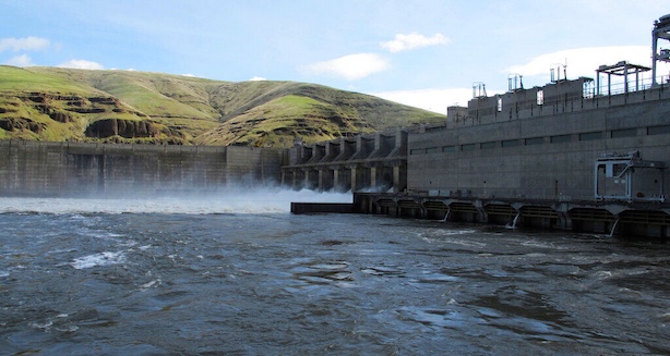 Water moves through a spillway of the Lower Granite Dam on the Snake River near Almota, Washinton. The benefits provided by four giant hydroelectric dams on the Snake River must be replaced before the dams can be breached to save endangered salmon runs, according to a final report issued last August by Washington Gov. Jay Inslee and Washington U.S. Sen. Patty Murray.