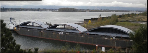 (ACOE) New Lower Monumental lock gates being delivered by barge.