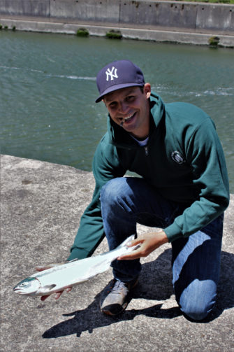 Jarrod Murray of Beaverton displays a sockeye salmon that he caught at the Cascade Locks on July 1. The fish hit a green Geisha Hootchie. (Terry Otto/The Columbian)