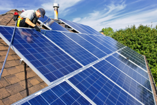Rooftop solar being installed. Solar 'Is Going to Overtake Everything'