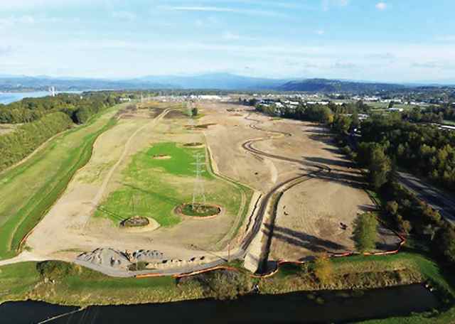Looking east, an aerial view shows the 90-acre wetlands restoration project by the Port of Portland that will be finished early next year to mitigate for creating about 250 acres of industrial land on the former Reynolds Metals property in Troutdale. (Quinton Smith photo)