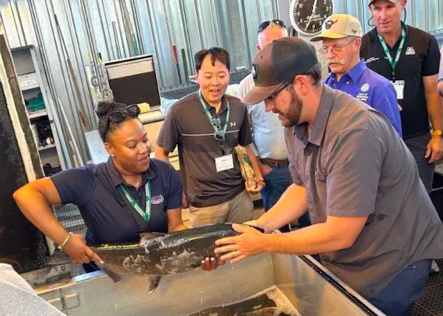Jaylene Kennedy helps researchers at the Lower Granite Dam fish research facility measure and weigh fish. Kennedy is a staffer for Florida Rep. Cory Mills, R-Florida. The participating staffers represented congressional members from Idaho, Florida, Georgia, Missouri and Nebraska.