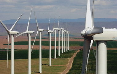 The Bonneville Power Administration is reining in wind energy production in the Columbia River basin because of high runoff and a resulting surge in hydro generation.