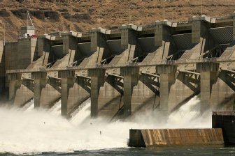 Columbia River spills through a dam's spillway when either hydropower turbines are running at capacity or not enough demand for the power or lately, to aid the migration of juvenile salmon and steelhead.