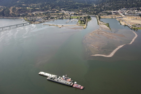 (Thomas Boyd) A Tidewater Barge Lines fuel barge grounded without mishap in the Columbia River on July 9 near Hood River - the fifth of five grounding or collision incidents in 17 months. Tidewater offloaded to another barge about 500,000 gallons of gasoline to refloat the stuck barge and get it on its way upriver.