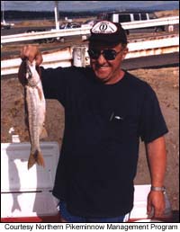 A Columbia River fisherman displays his pikeminnow catch.