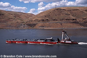 (Brandon Cole photo) Barge on Snake river transporting juvenile salmon.