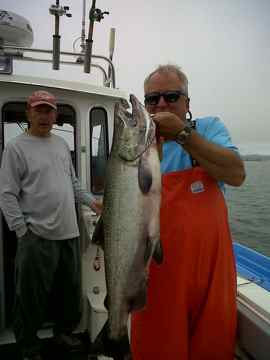 (Mark Yuasa photo) A proud fisherman shows his catch.