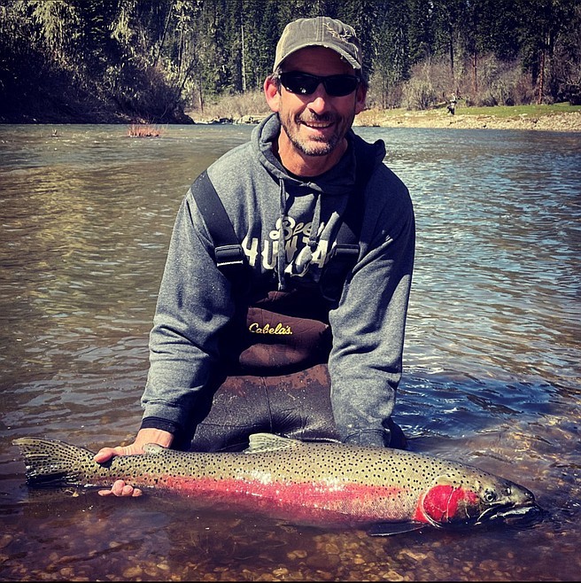 Scott Turner shows off a 39.25-inch steelhead from the South Fork Clearwater River, setting a new catch/release state record.