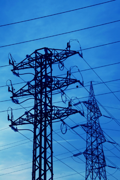 Electricity transmission lines criss cross the sky