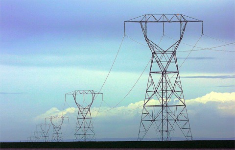 (Larry Davis/New York Times) Power lines belonging to Bonneville Power Administration run through a field of winter wheat. Bonneville hopes to expand transmission capacity with new leverage acquired by the stimulus package.