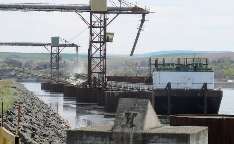 A grain barge is loaded at the Port of Lewiston in Idaho in 2013. Container shipping has ended but wheat shippers say they need river shipping. (Nicholas K. Geranios AP photo)