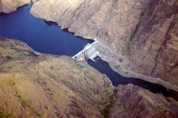 Aerial view of Hells Canyon Dam and the reservoir it backs up to Oxbow Dam (not visible) which impounds water up to Brownlee Dam.  Three comprising the Hells Canyon Project owned and operated by Idaho Power.