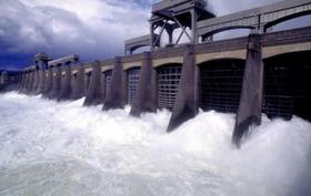 (Don Ryan) Water rushes through spillway gates of Bonneville Dam near Cascade Locks, Ore. Increased spills benefit salmon.